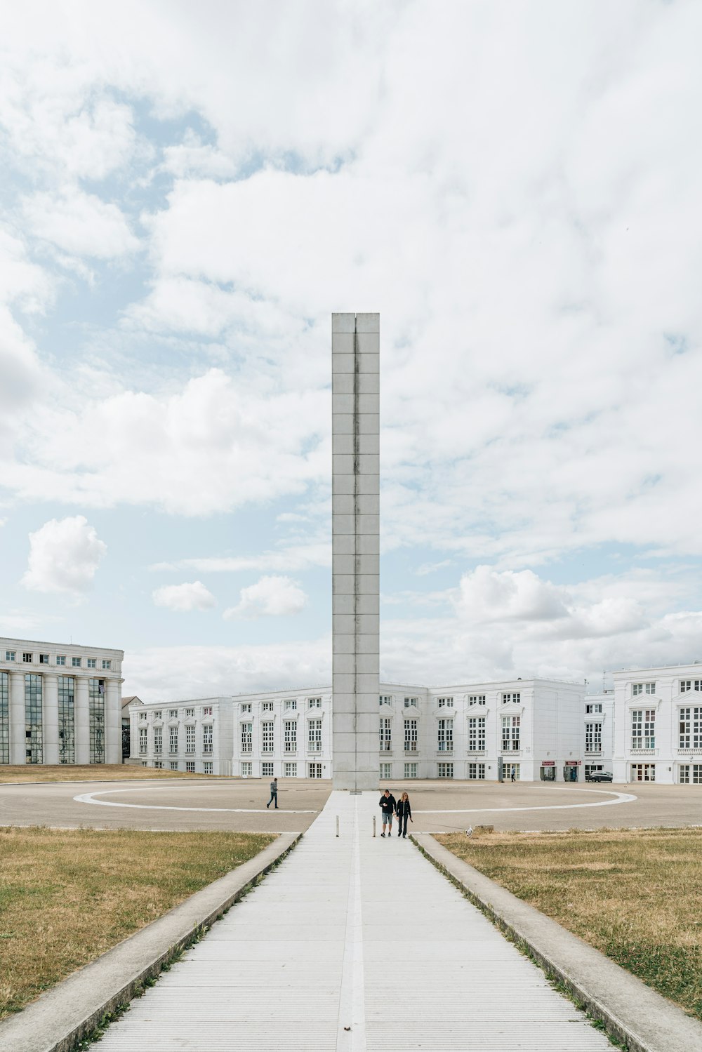 two people are standing in front of a monument