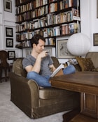 man sitting on sofa chair