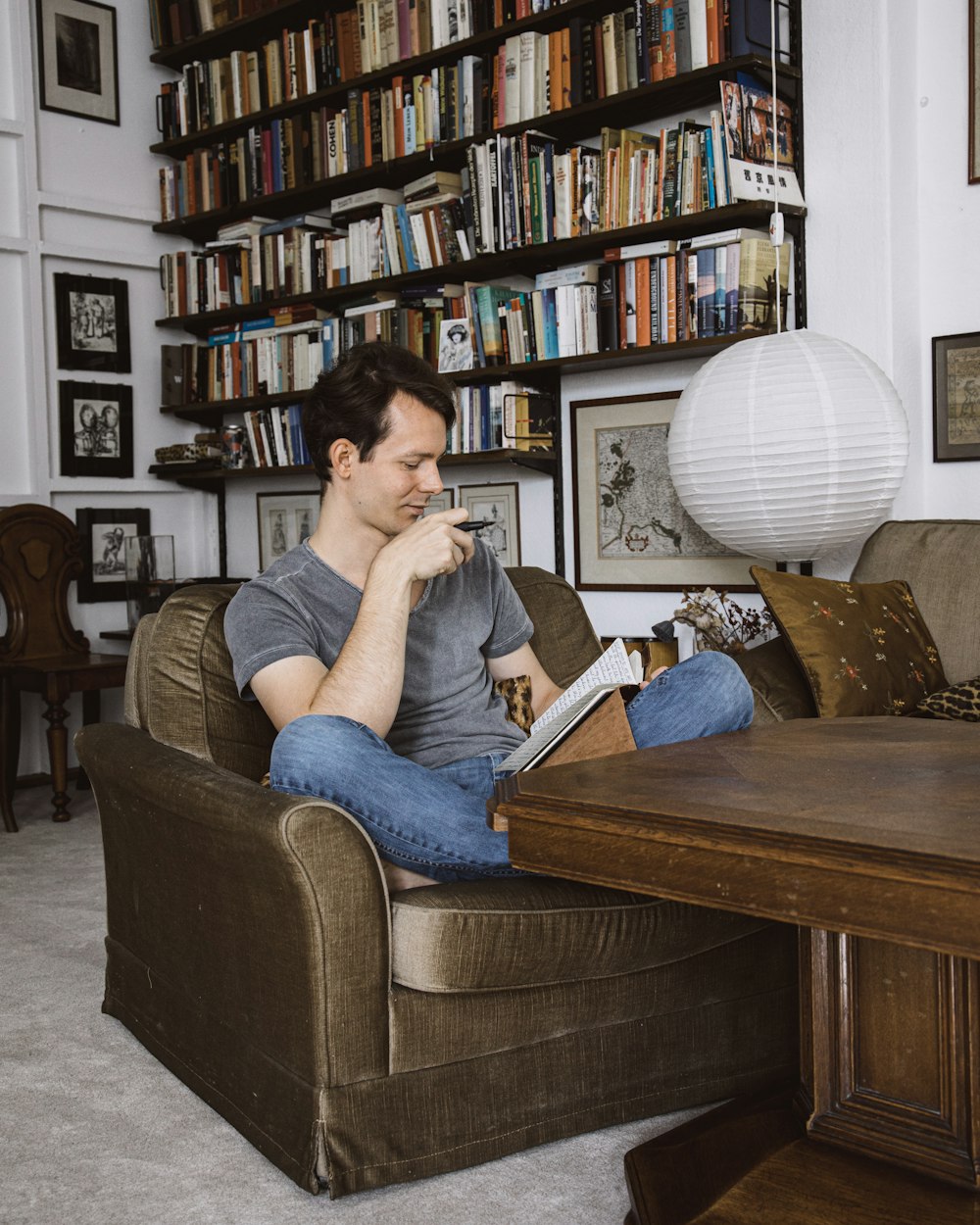 man sitting on sofa chair