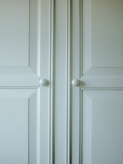 Close-up of a sleek aluminum cabinet door with a smooth finish, showcasing quality craftsmanship.