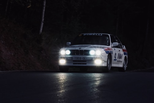 Close-up of Ogier focused behind the wheel during a night stage.