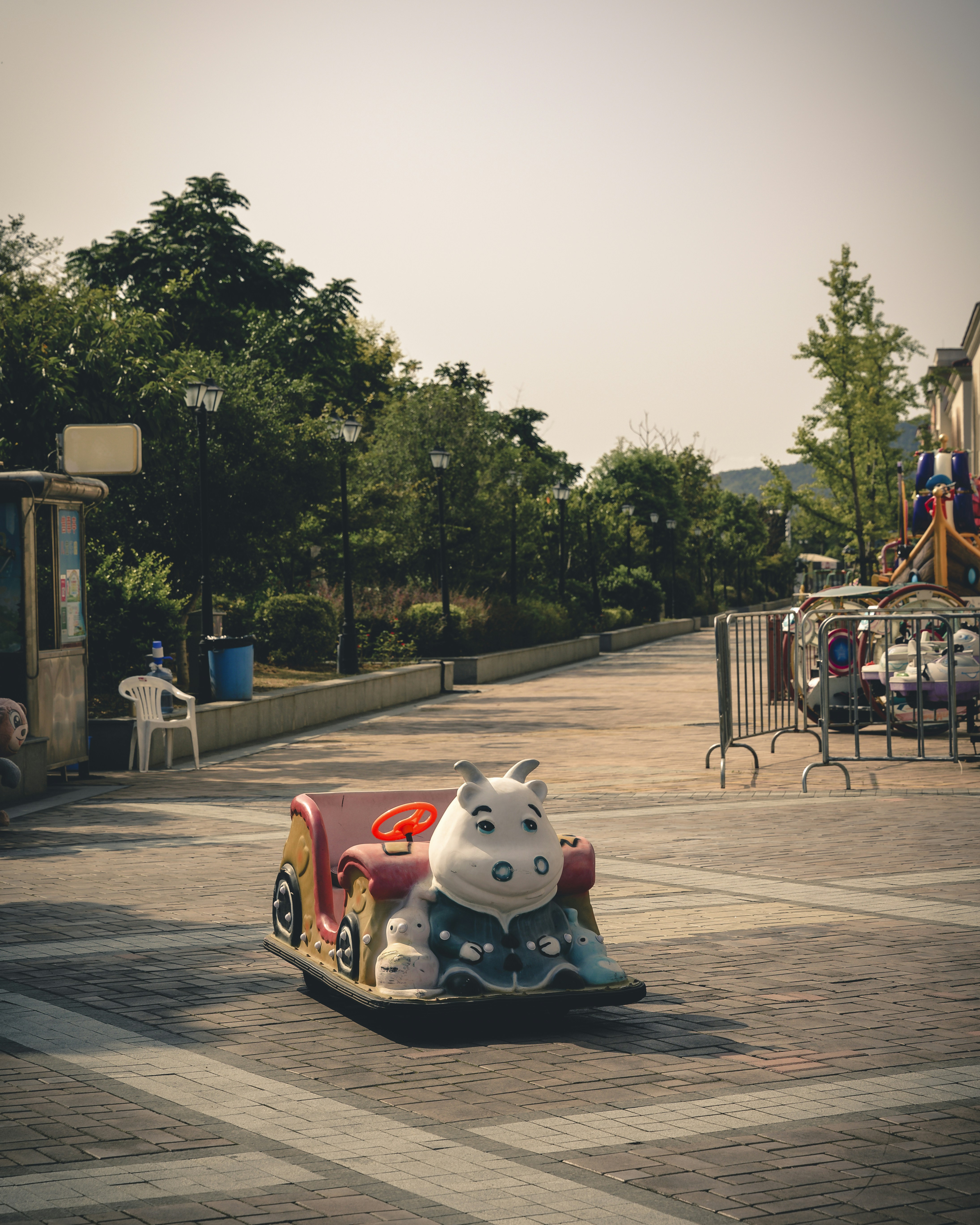 white and multicolored ride-on toy at daytime