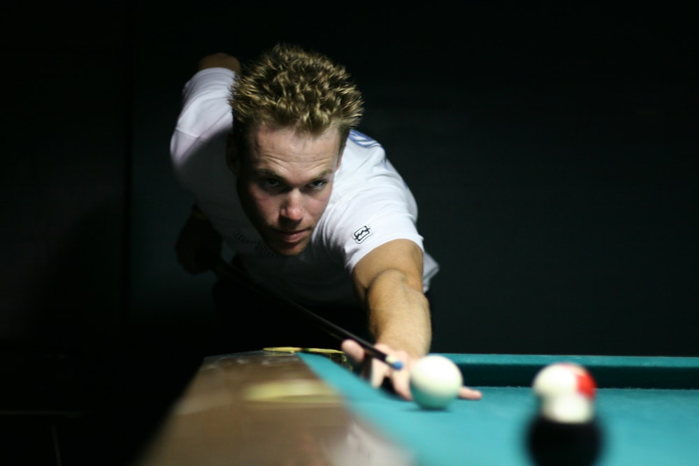 man playing billiard