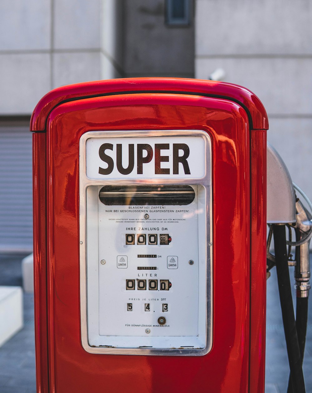 red and white Super gas dispenser