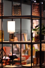 turned-on lamp on shelf at the living room