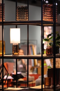 turned-on lamp on shelf at the living room