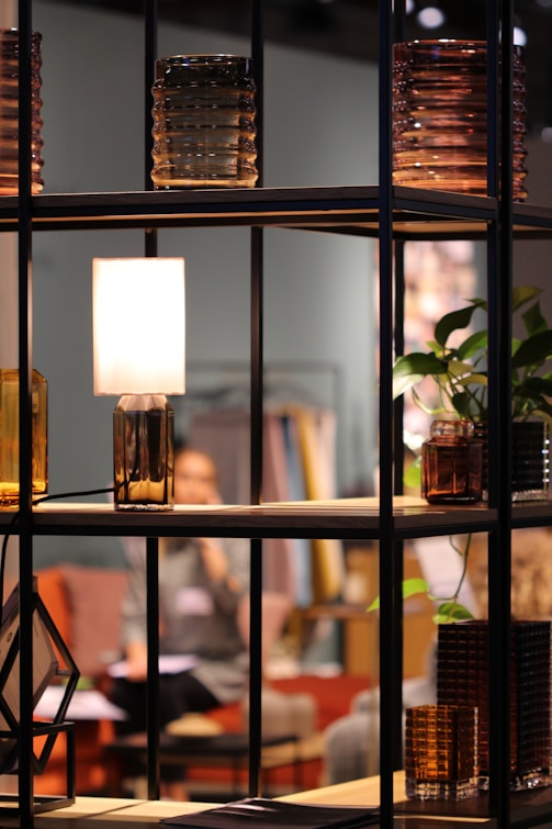 turned-on lamp on shelf at the living room