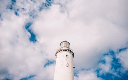 white light house at daytime in Fårö fyr Sweden