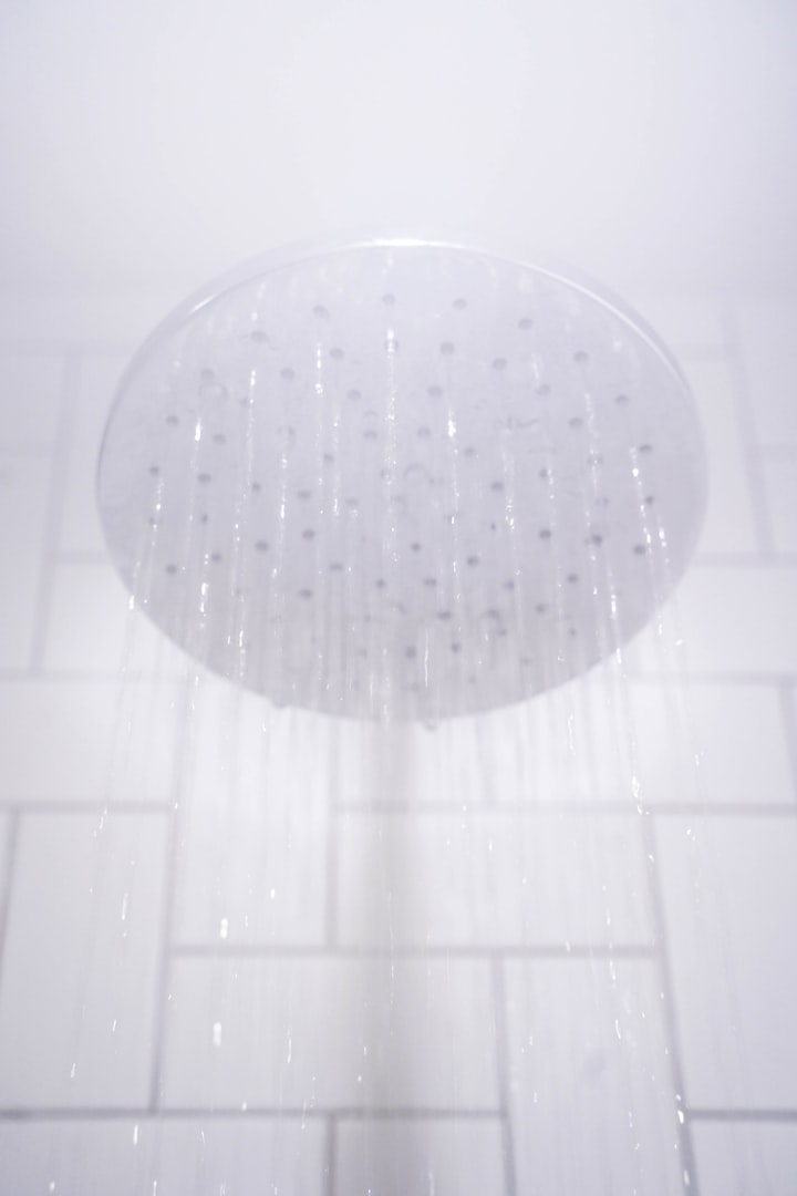Shower head with water flowing showing water pressure output