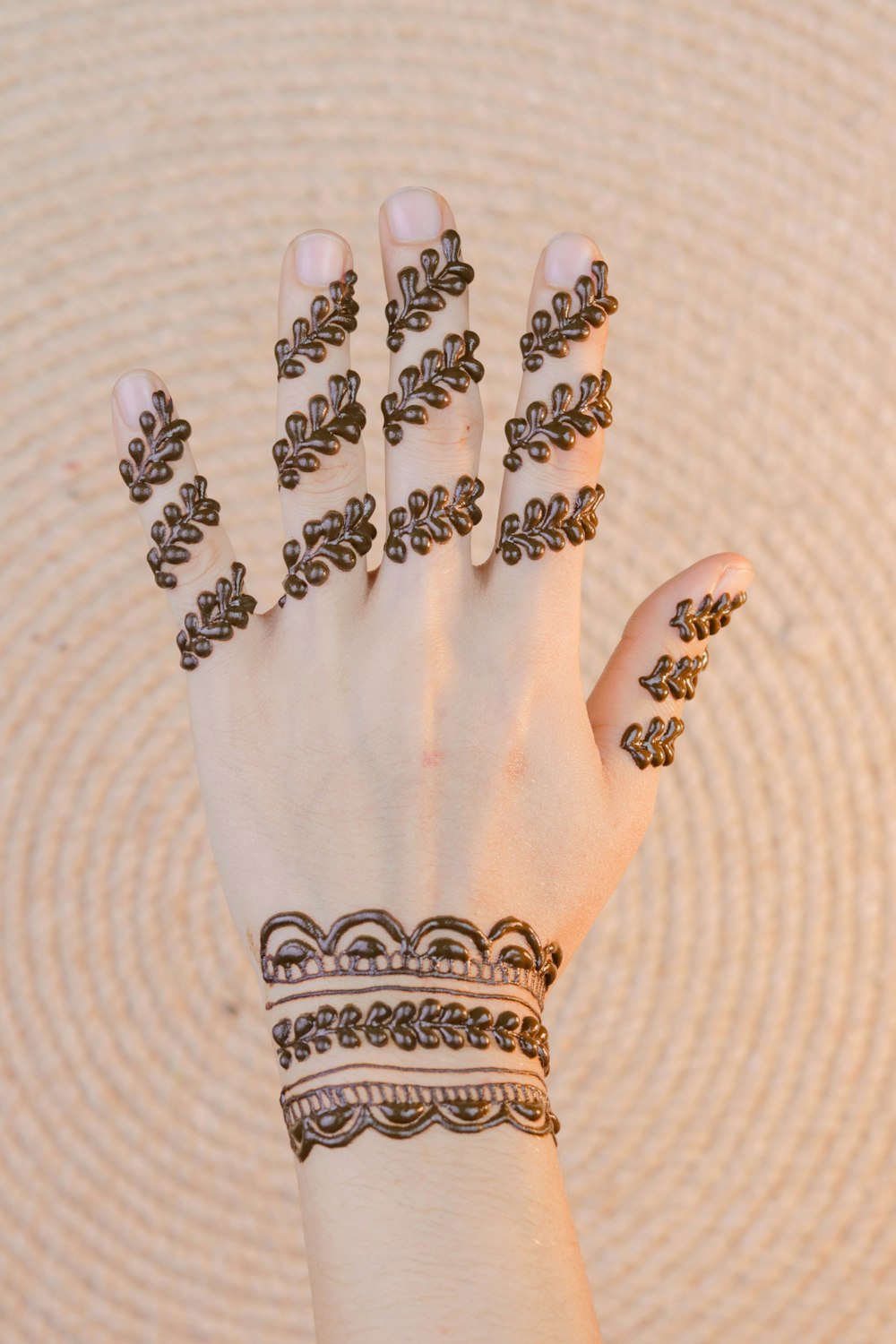 left human hand with henna