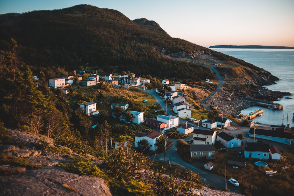 aerial photography of buildings near mountain during daytime