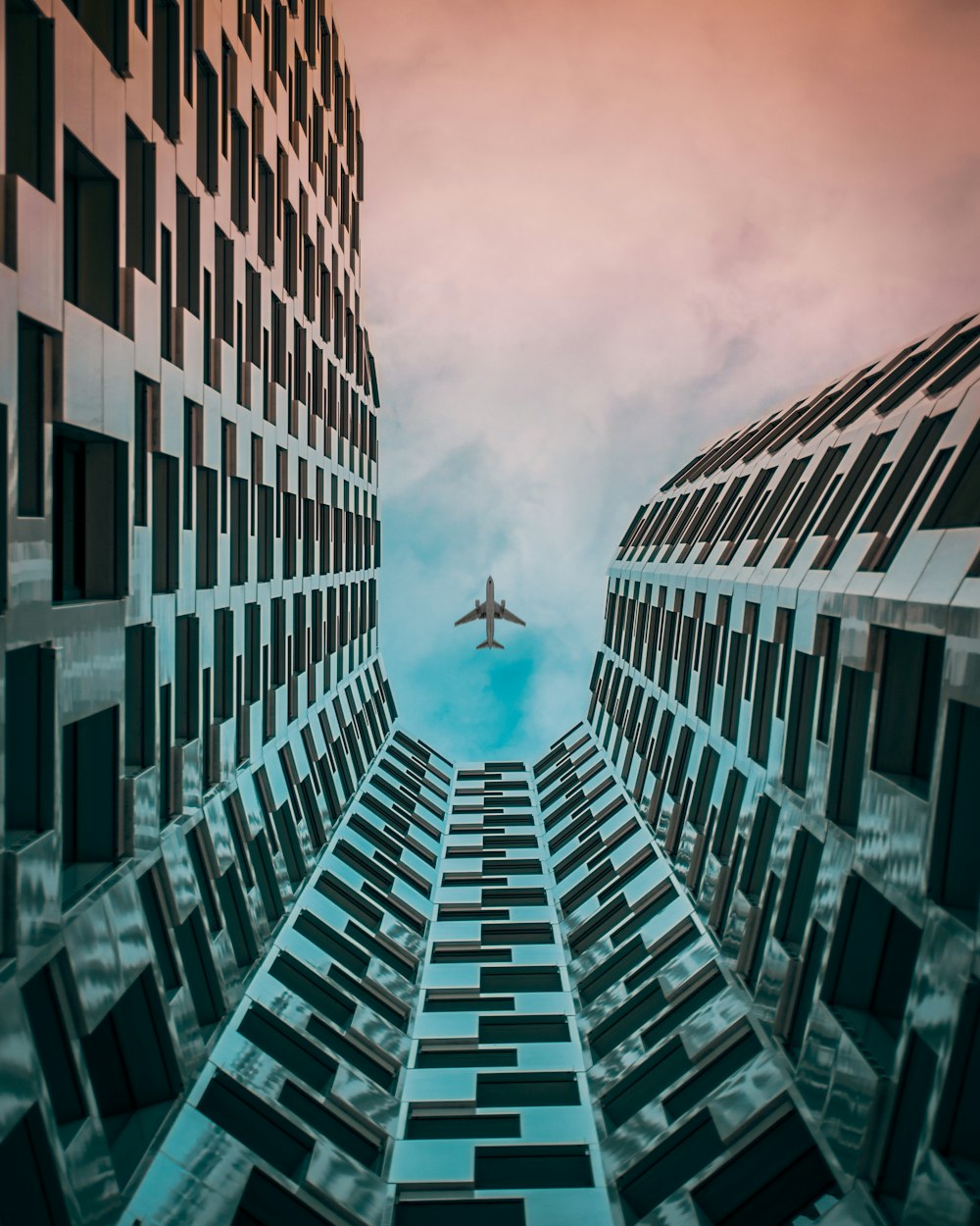 airplane above building during day