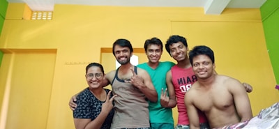 Smiling rosto team members gathered together, showcasing the spirit behind the brand.