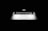 A partially opened laptop with a glowing apple logo on the back of the screen, set against a black background. The keyboard and touchpad are visible, with light reflecting off the metallic surface, creating a sleek and modern appearance.