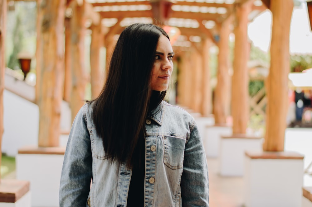 woman wearing blue denim jacket