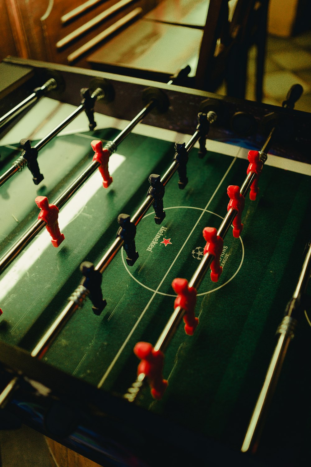 photo of black and green foosball table