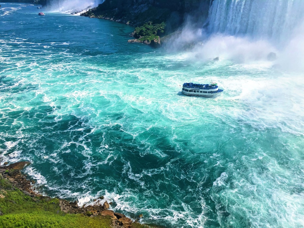 boat near waterfall