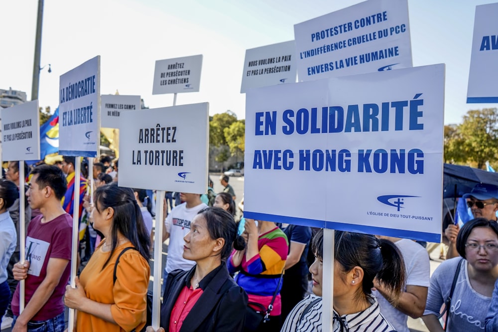 people raising signages