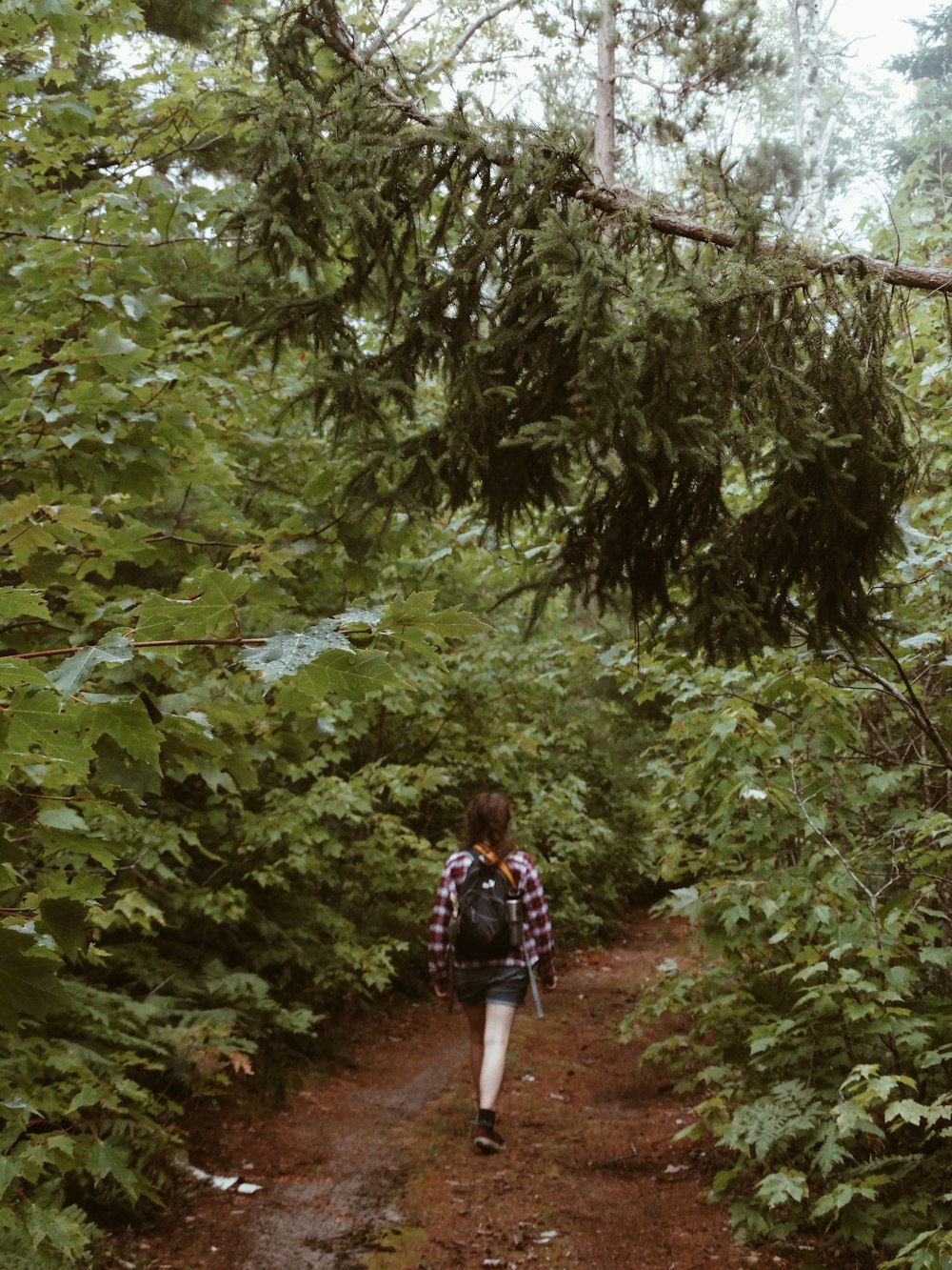 woman wears black backpack