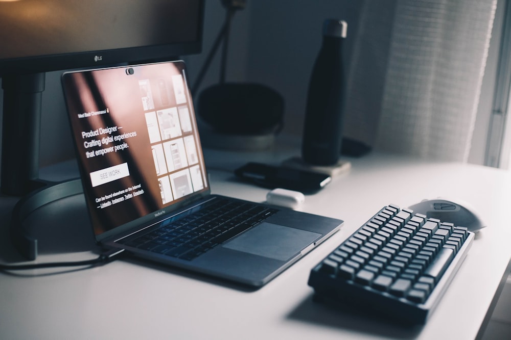 black keyboard beside laptop