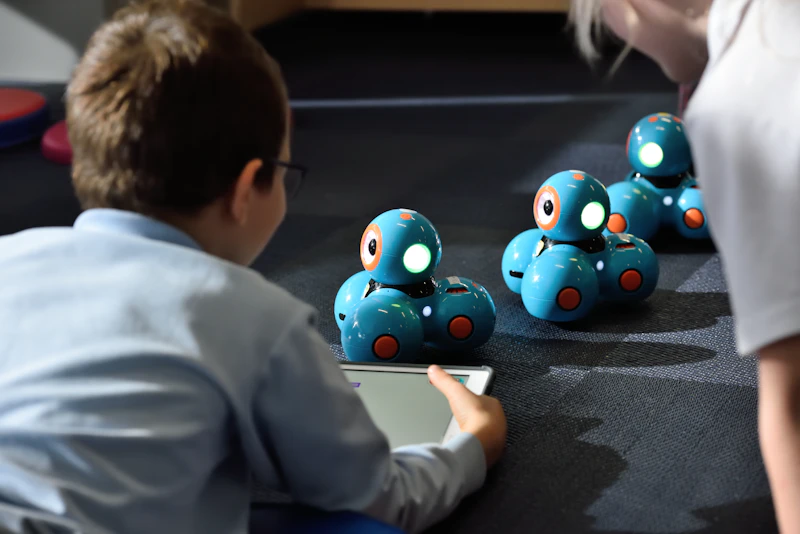 Kids working together at a robotics holiday camp