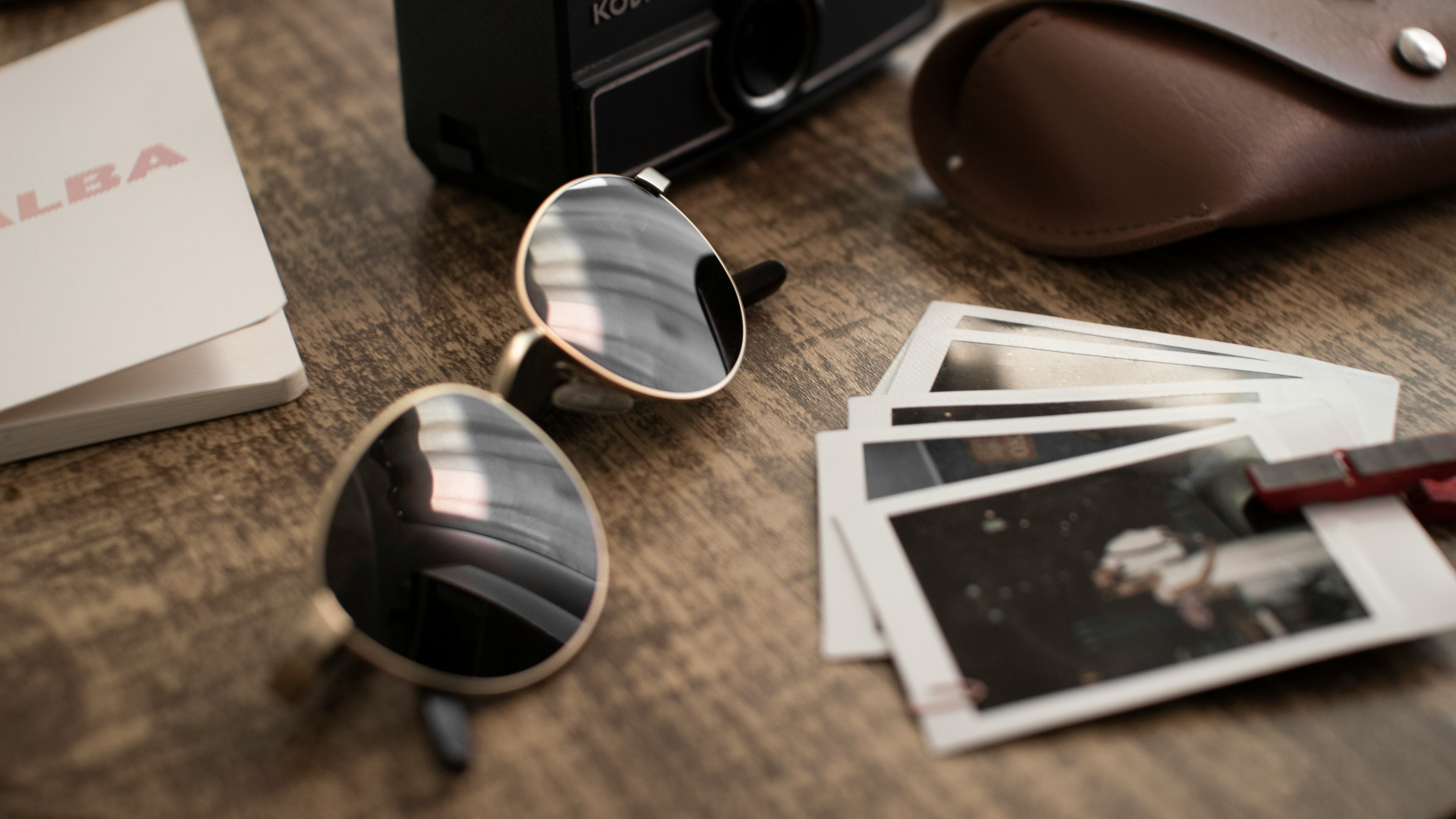 shallow focus photo of black sunglasses with silver frames