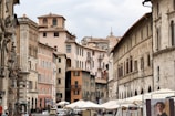 Scenic snapshot of European city streets lined with historic architecture and lively cafes