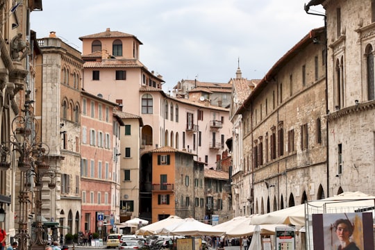 brown concrete buildings during daytime in Perugia Italy