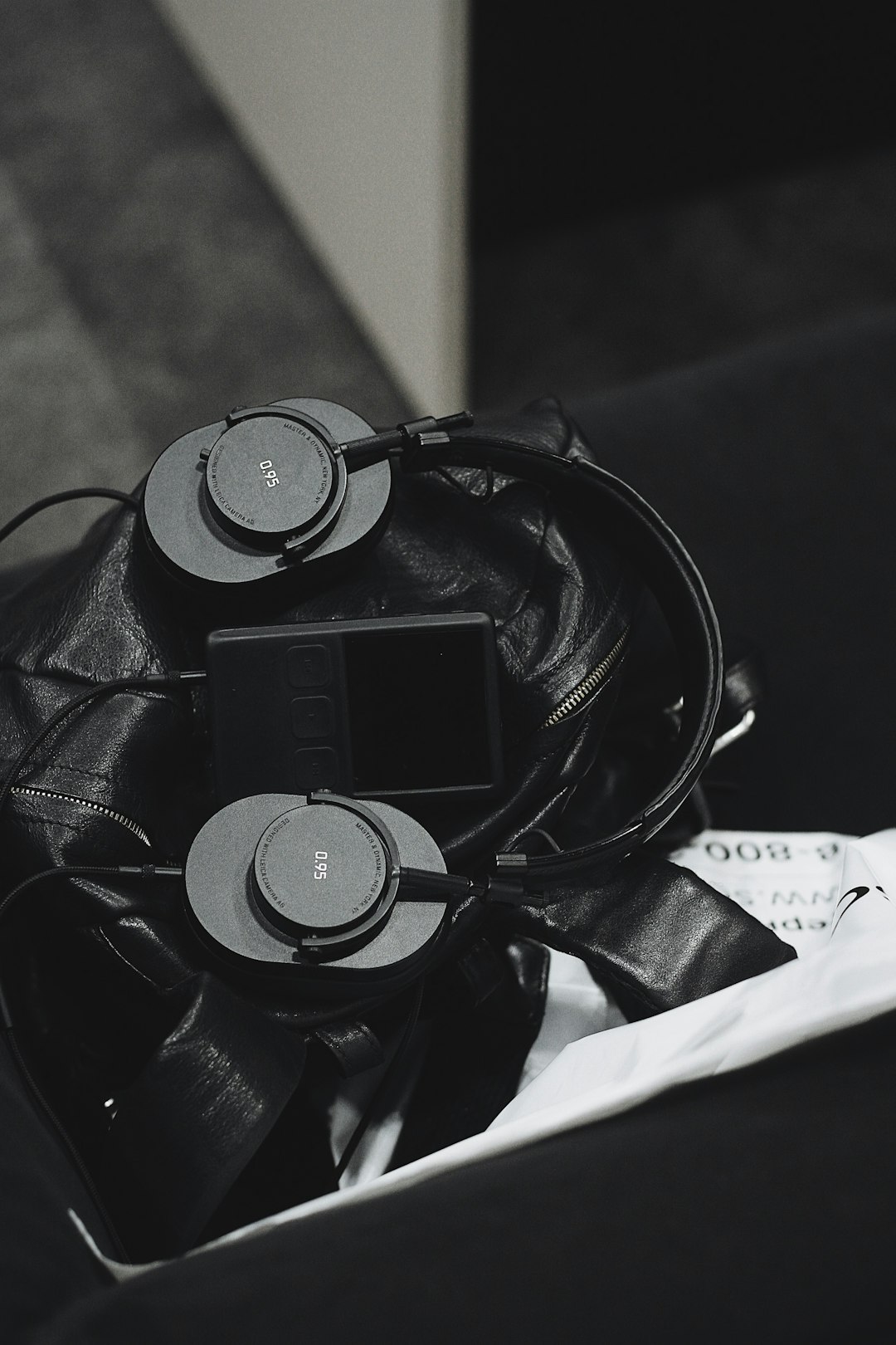 grayscale photo of headset and music player