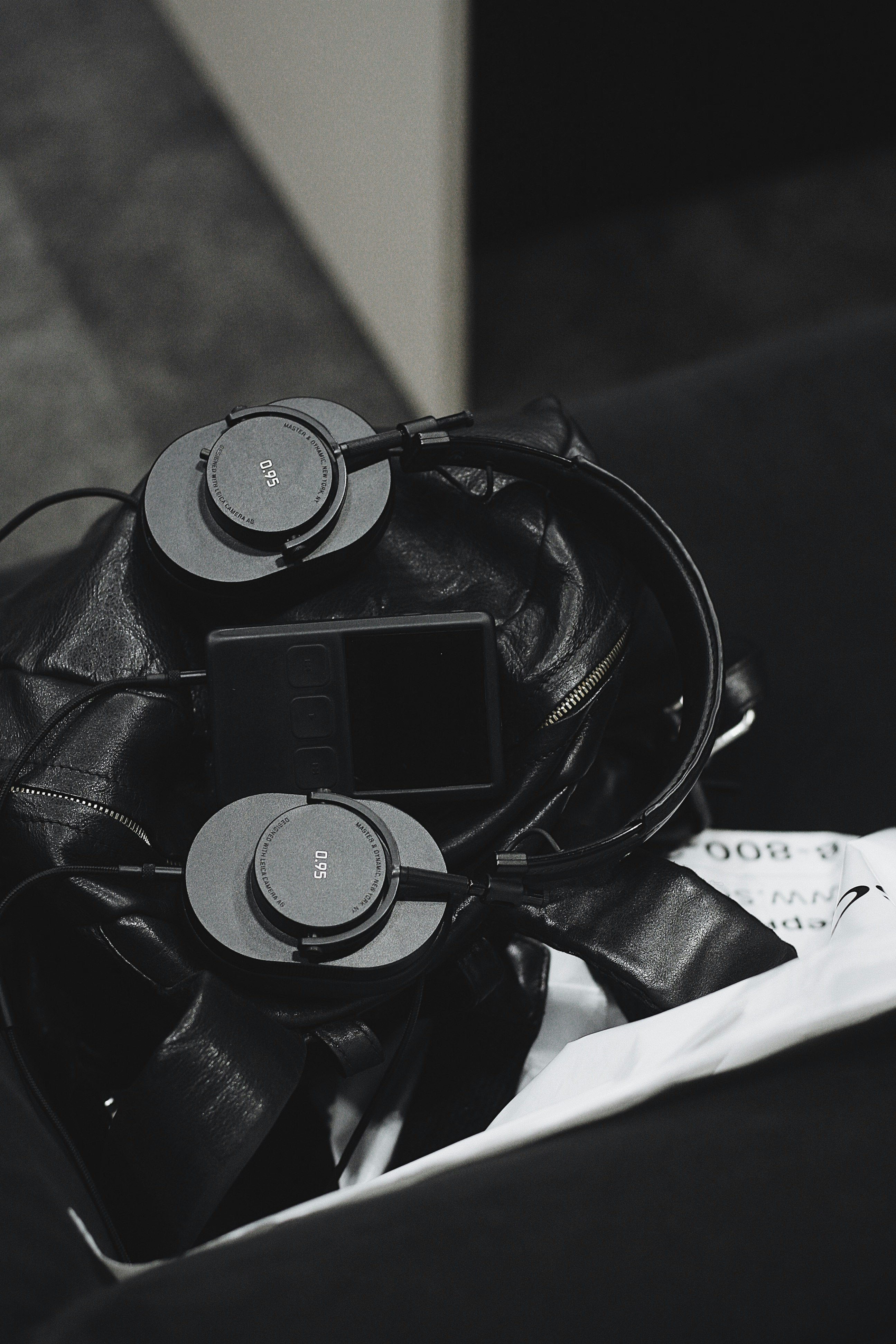 grayscale photo of headset and music player