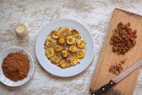 An assortment of banana powder products on a wooden table.