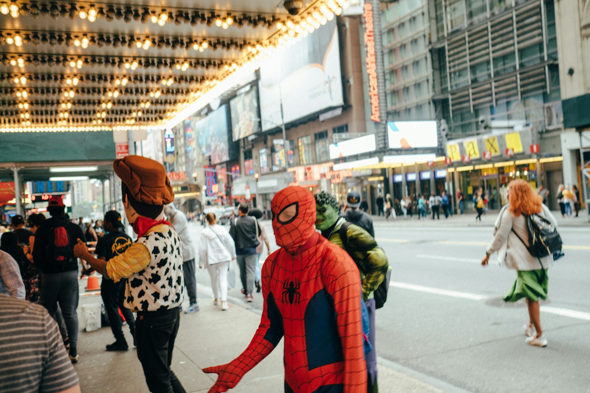 A vibrant movie theater scene with excited fans dressed as their favorite sci-fi characters.