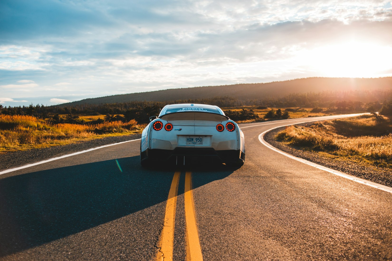 Silver car on a road