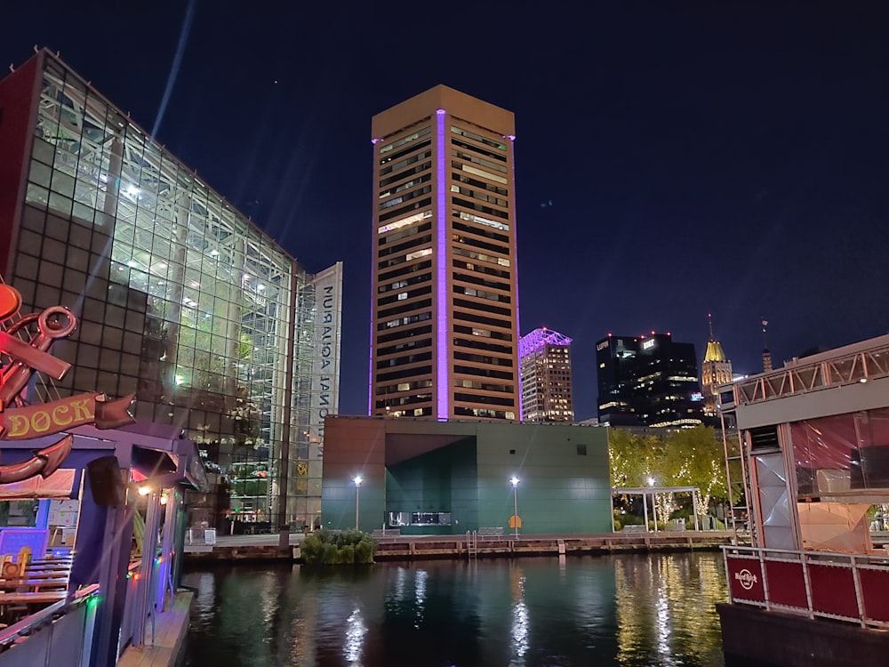 beige high-rise building with pink light