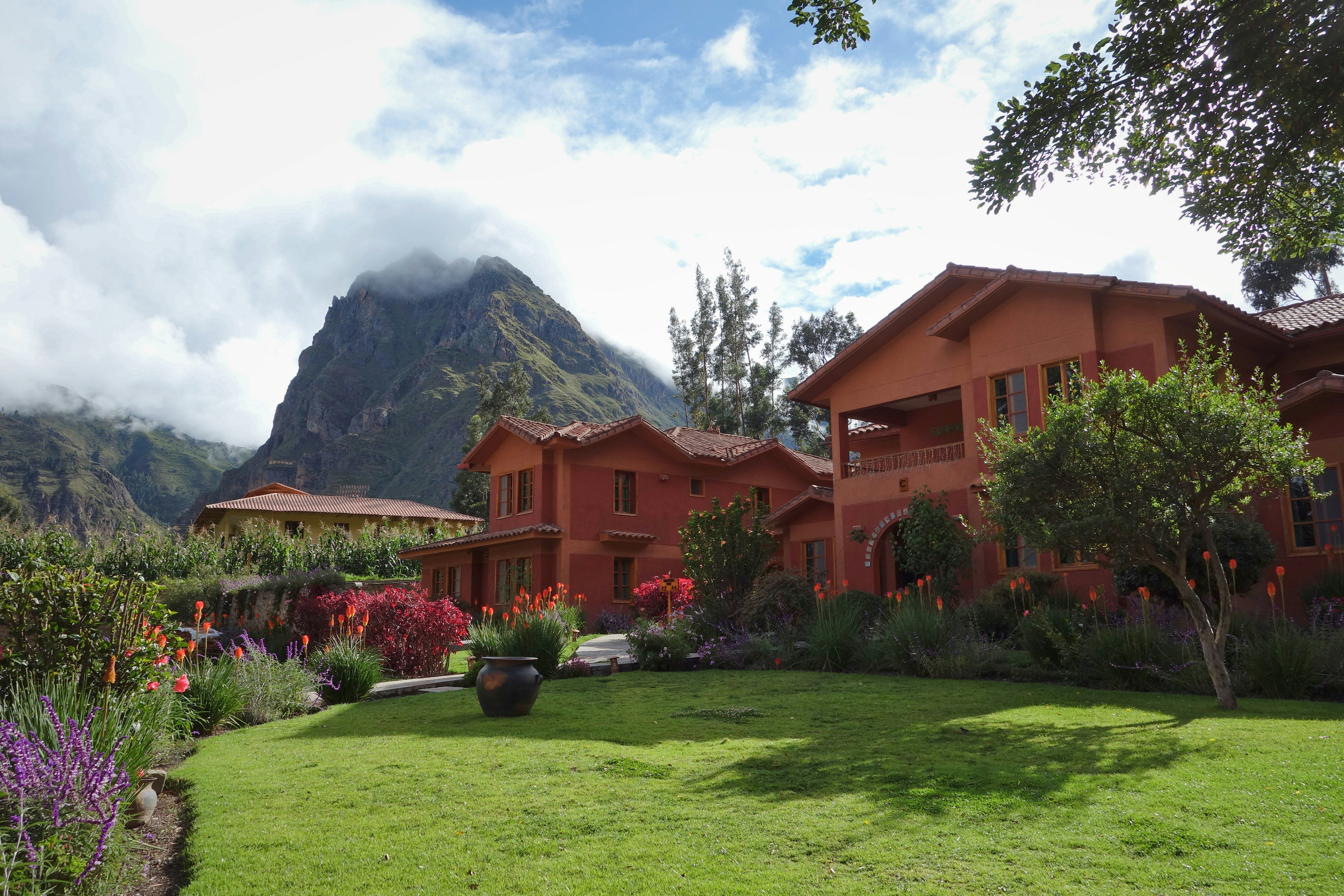 brown house surrounded by plants, Sacred Valley of Incas