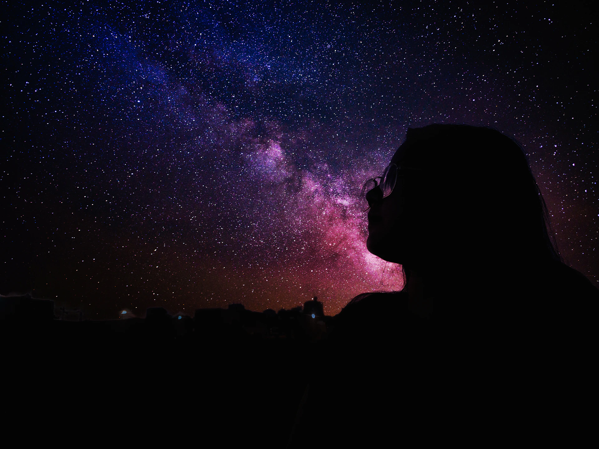 a person looking up at the stars in the sky