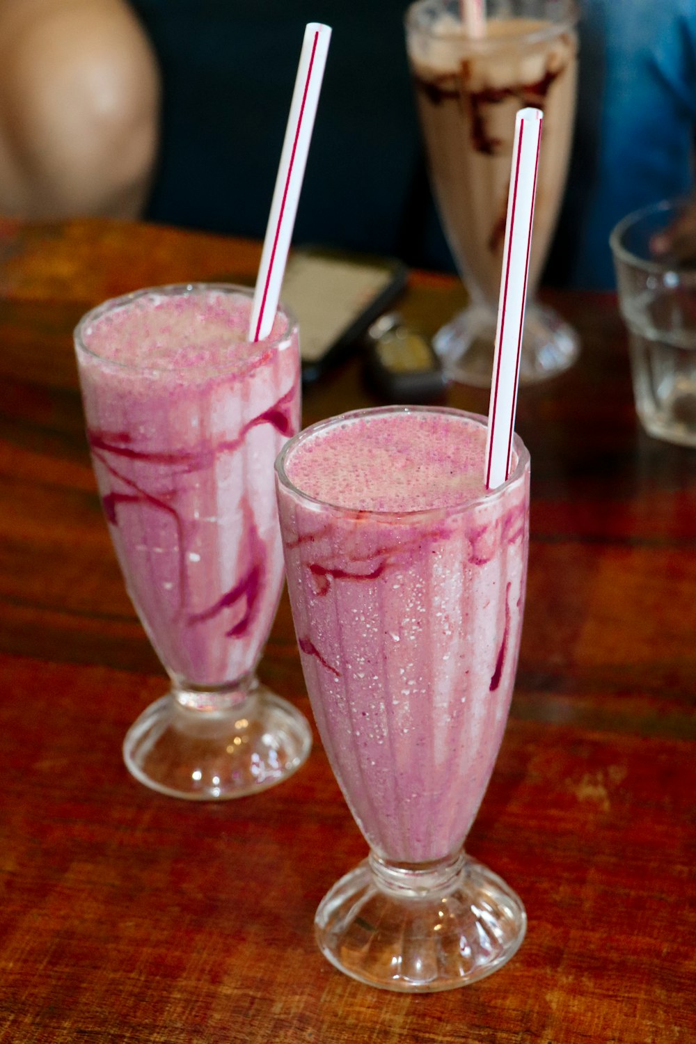 strawberry shakes on footed glass