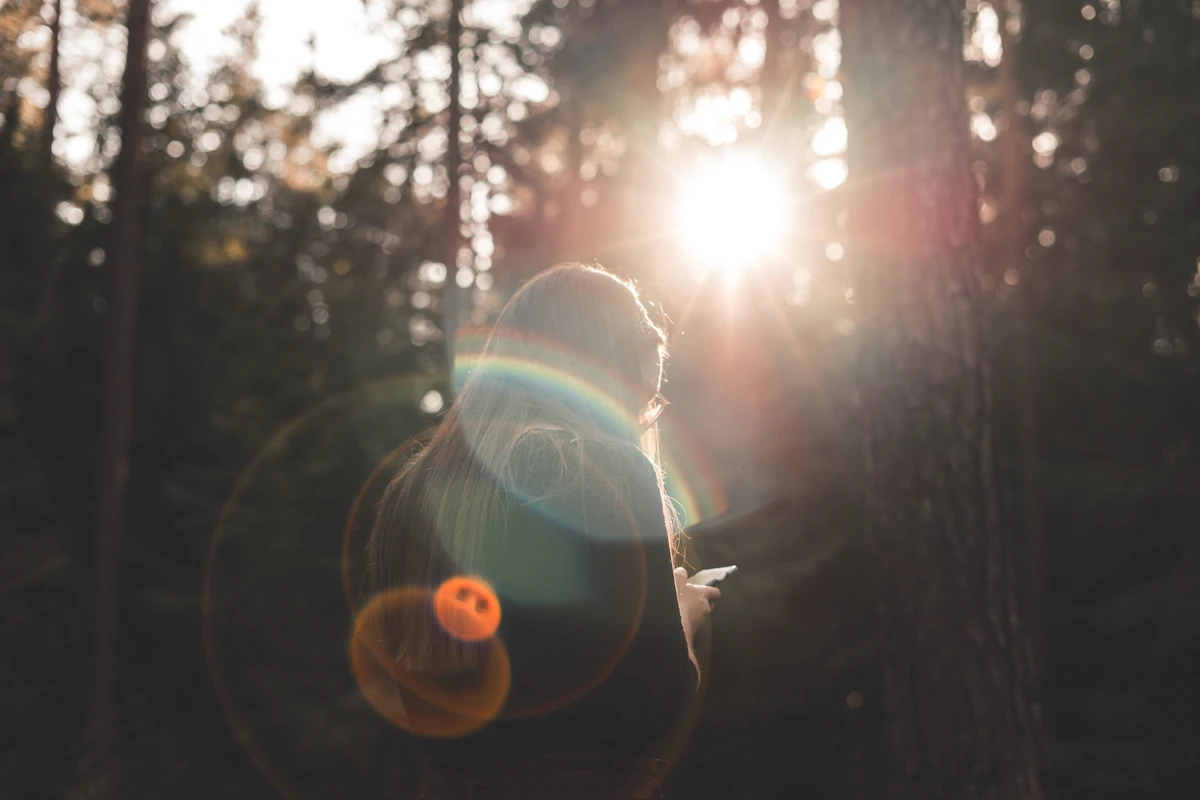 A woman looking at her smartphone outdoors