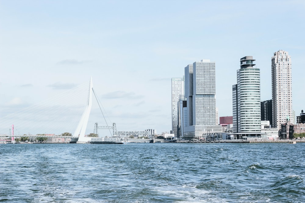 body of water near high buildings at daytime