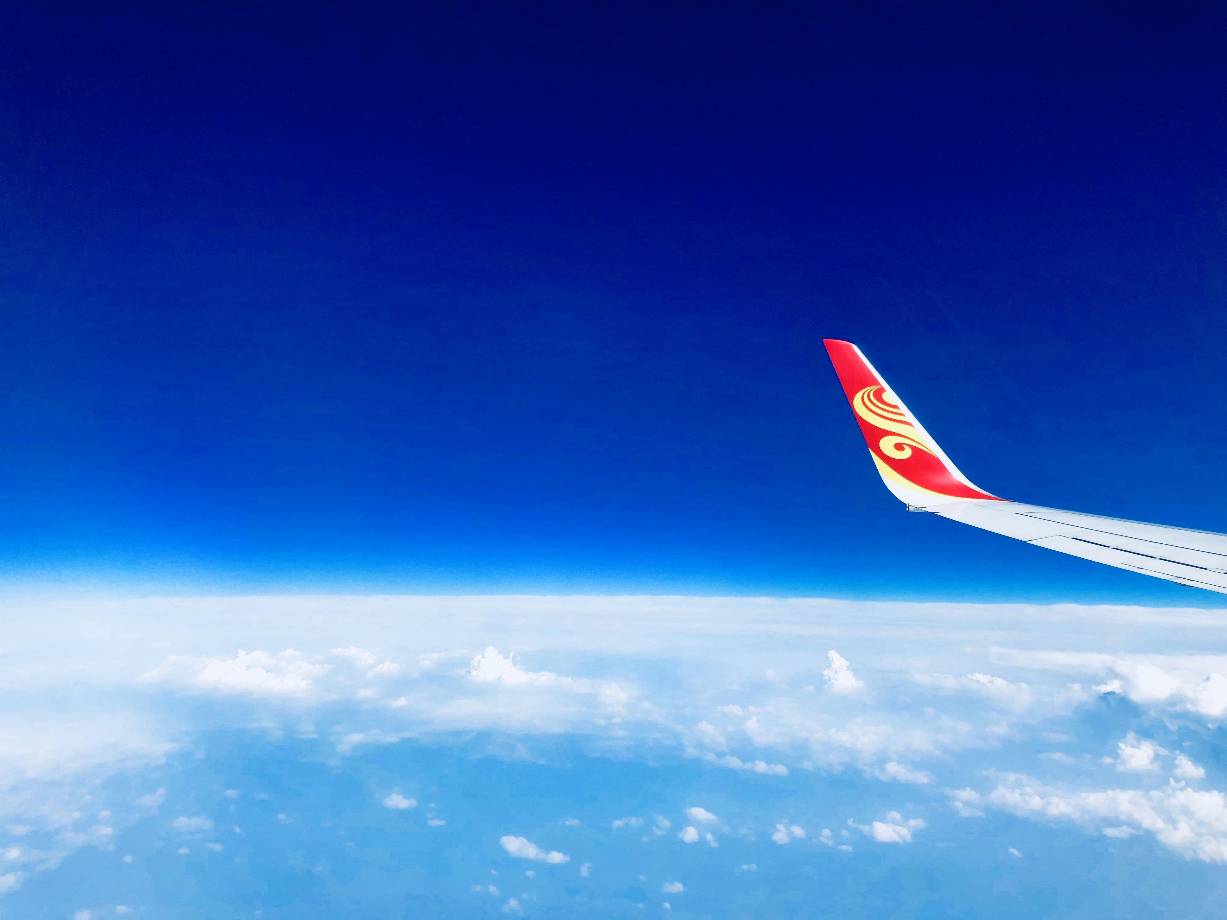 white and red airplane wing