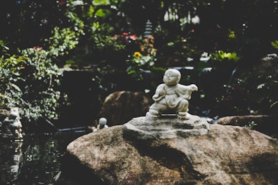 Marble statue of a joyful child reflecting warmth and care.