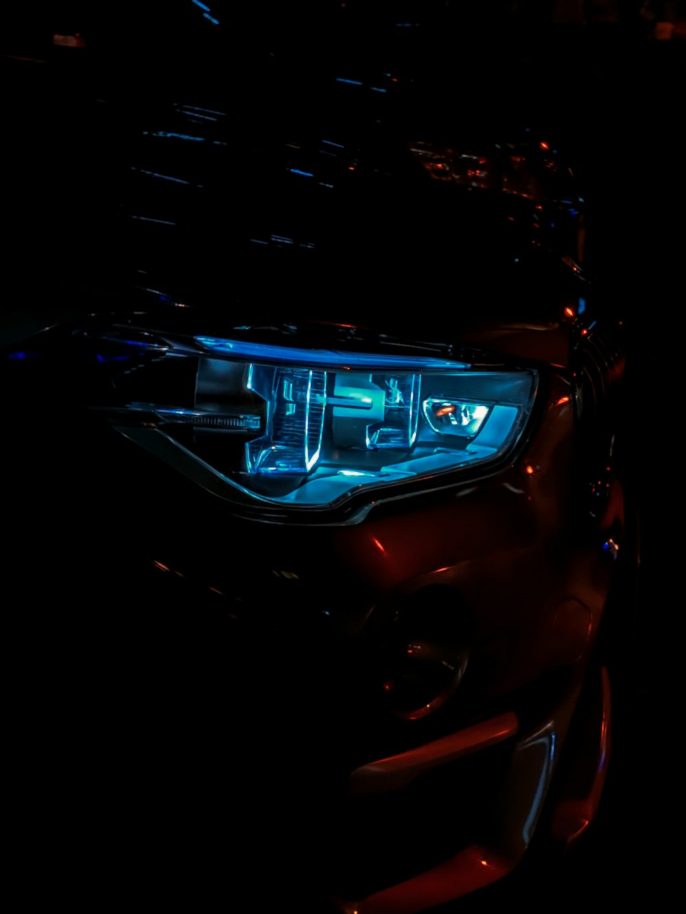 close-up photography of vehicle headlight