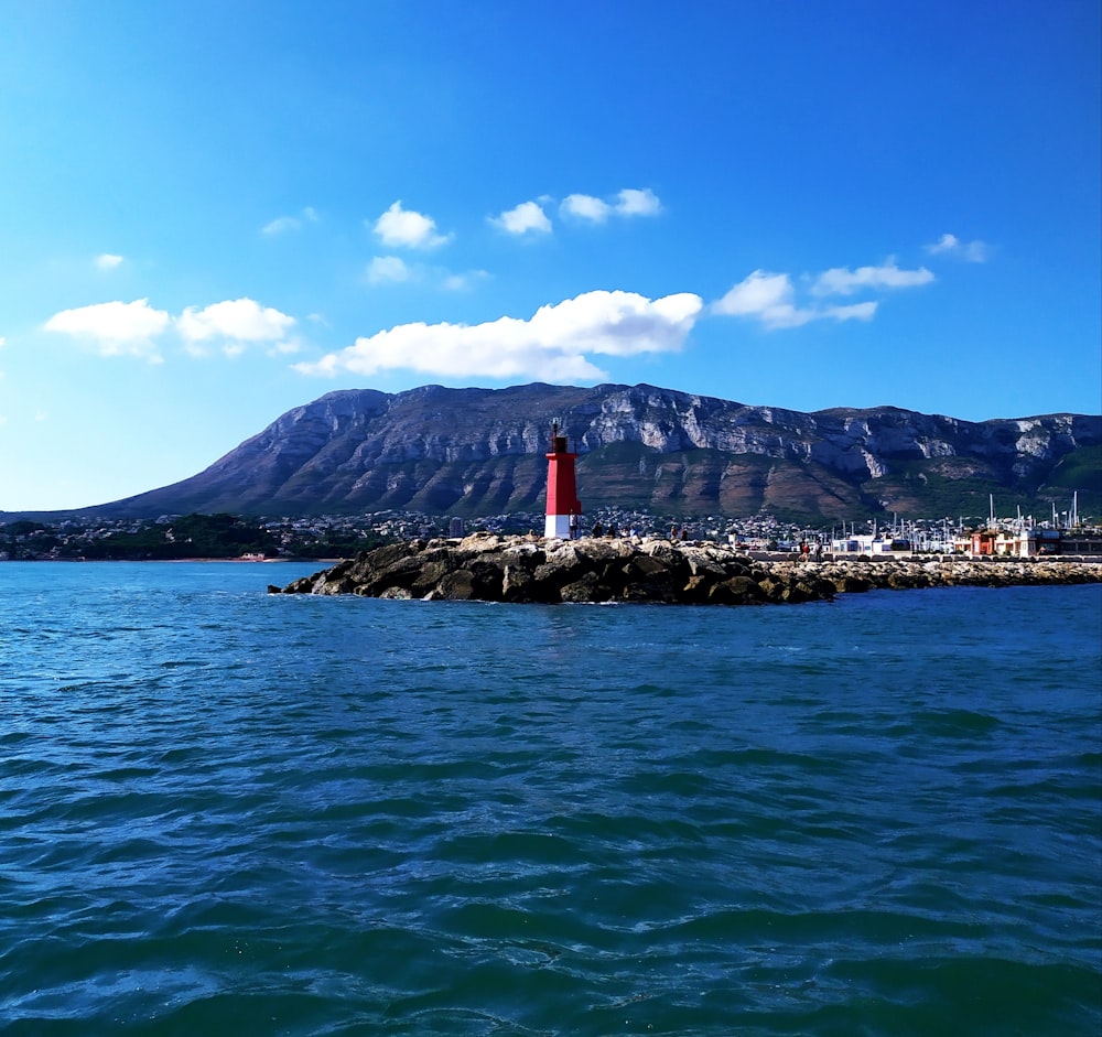 red and white lighthouse tower at daytime