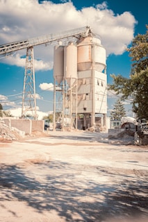 white factory building near tree