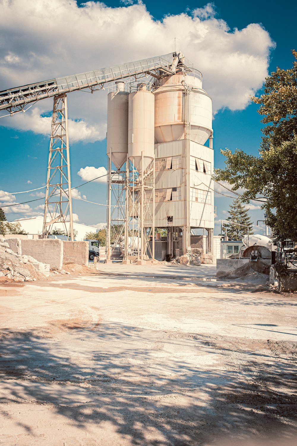 white factory building near tree