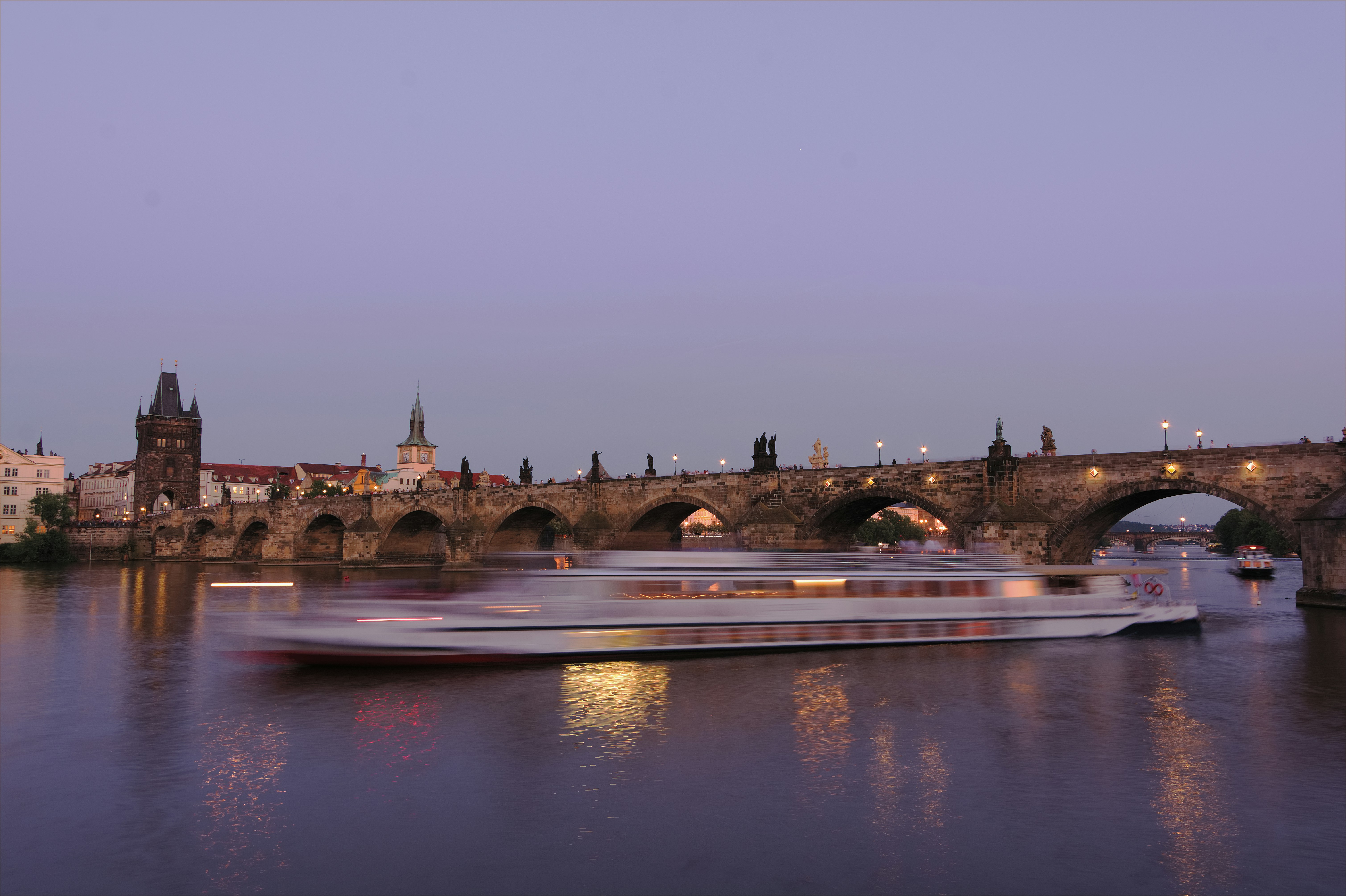 Boat on Vltava river, Prague, Czech republic, Charles bridge