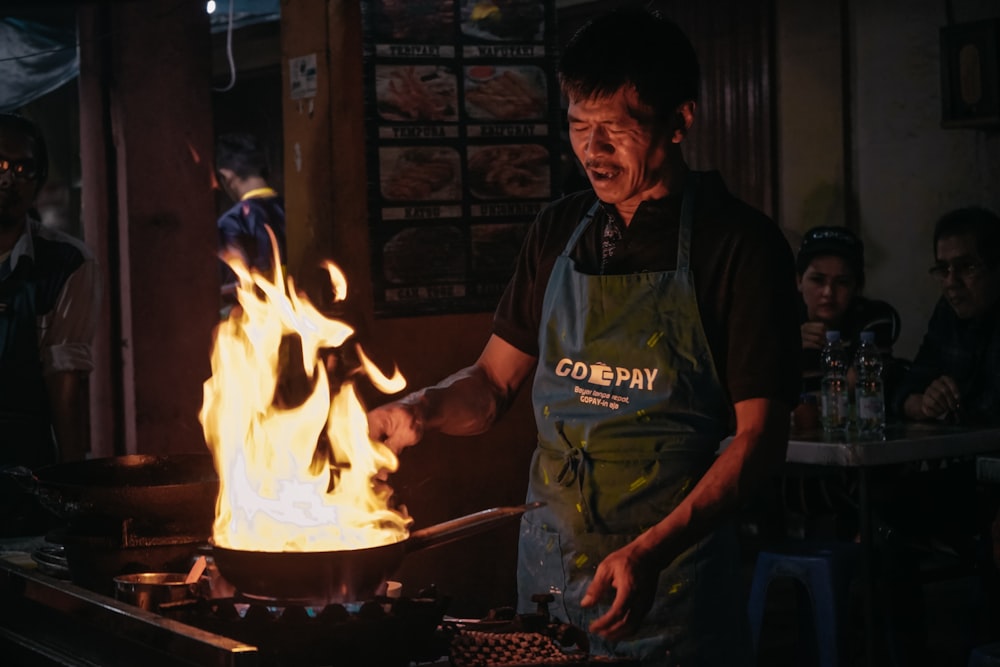 man in green apron