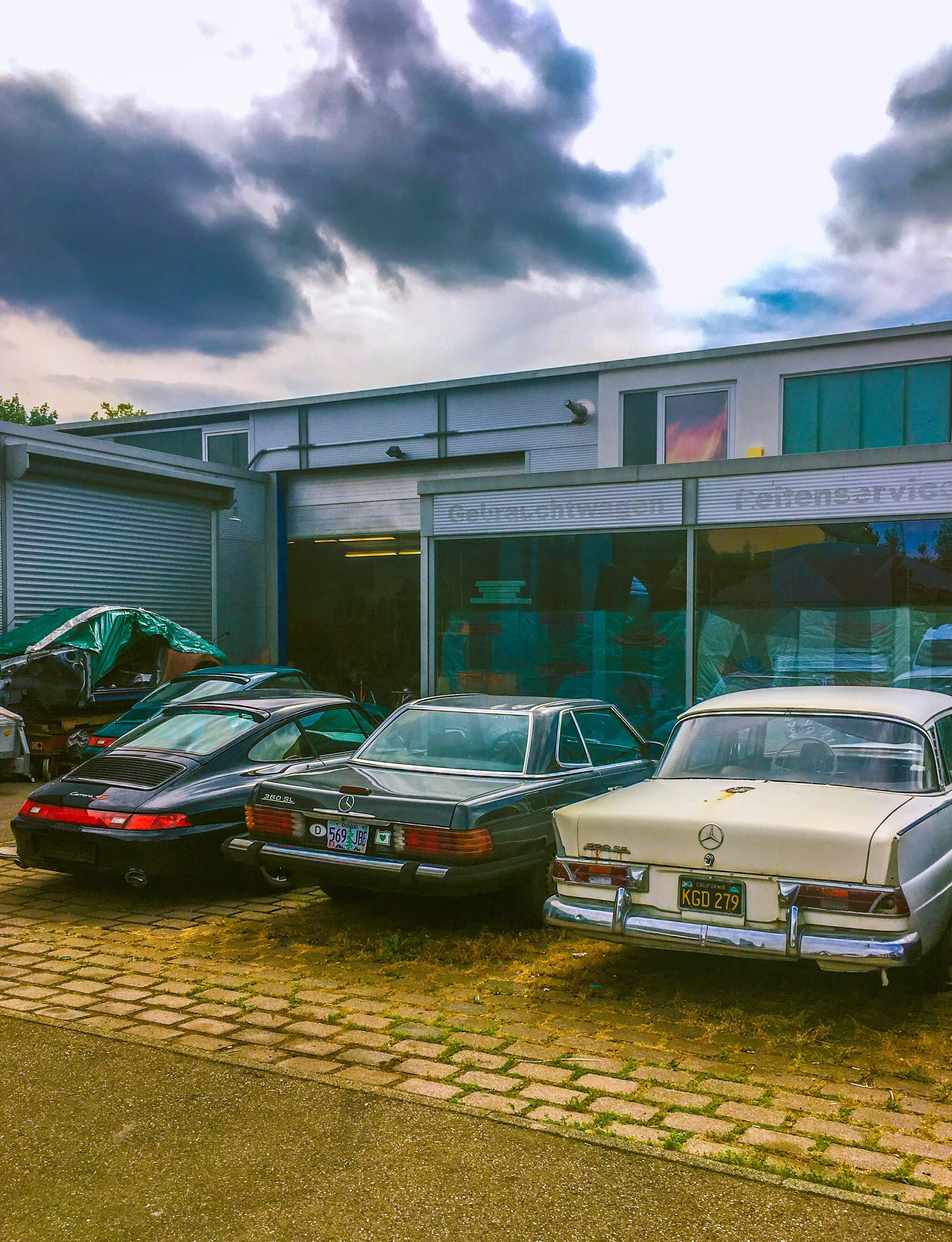vehicles front of building at daytime