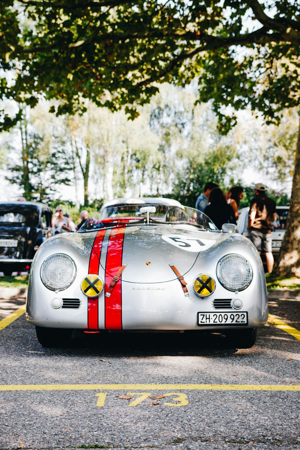 close-up photography of silver vehicle near tree