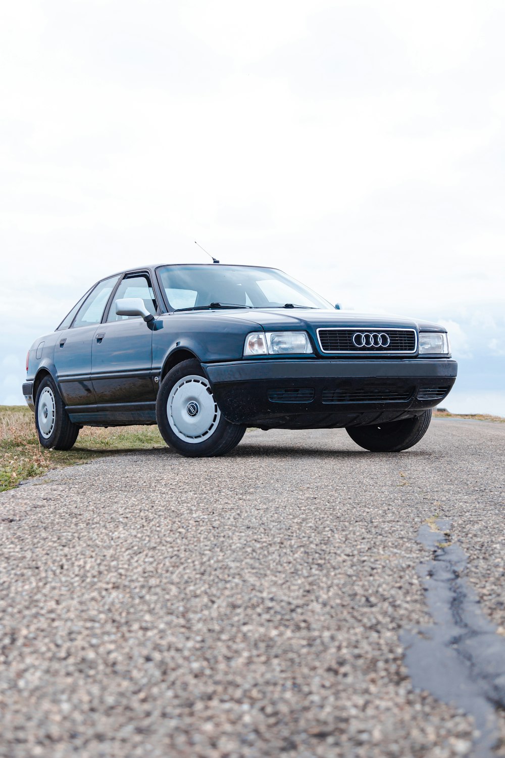 black Audi sedan on the road